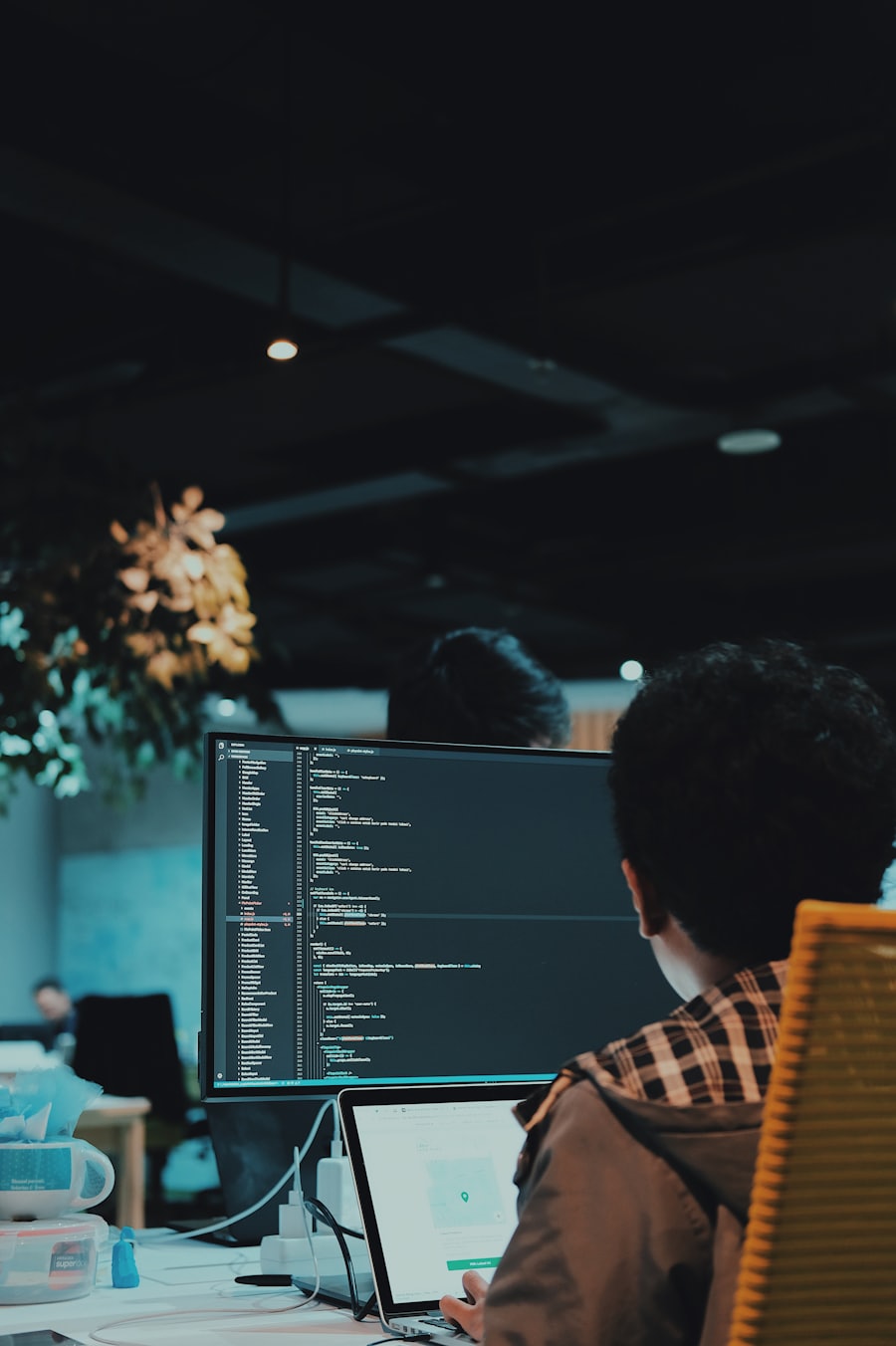 A developer at a monitor reviewing configuration
