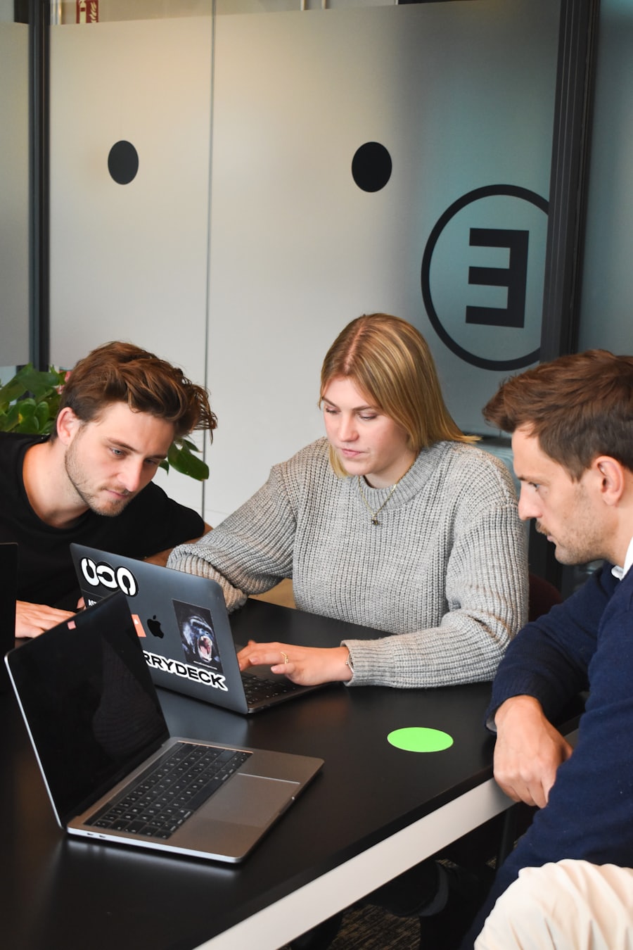 A scoping conversation around a laptop