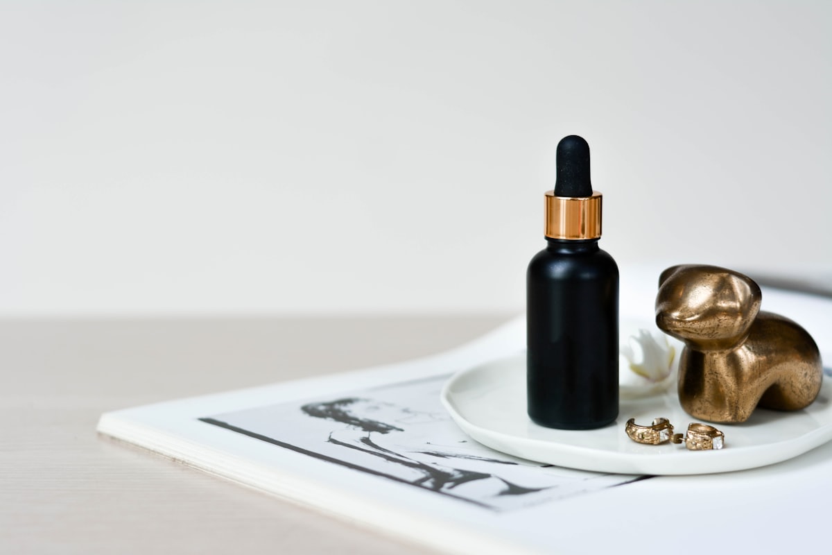 Dusk Oil bottle and dropper on a ceramic plate