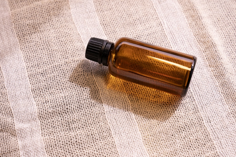 Amber glass dropper bottle of Dusk Oil on a stone surface